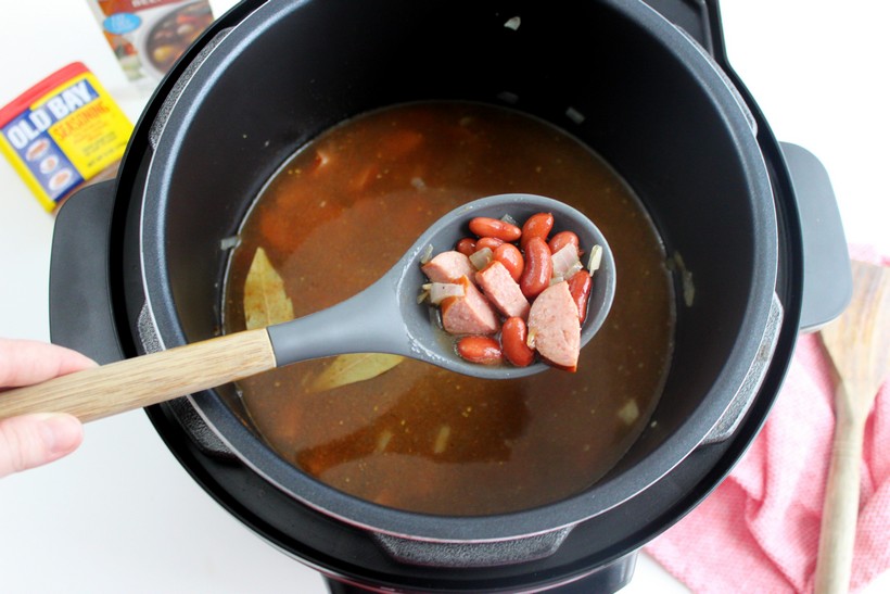 overhead shot of Spoonful of Red Beans and Rice over pressure cooker