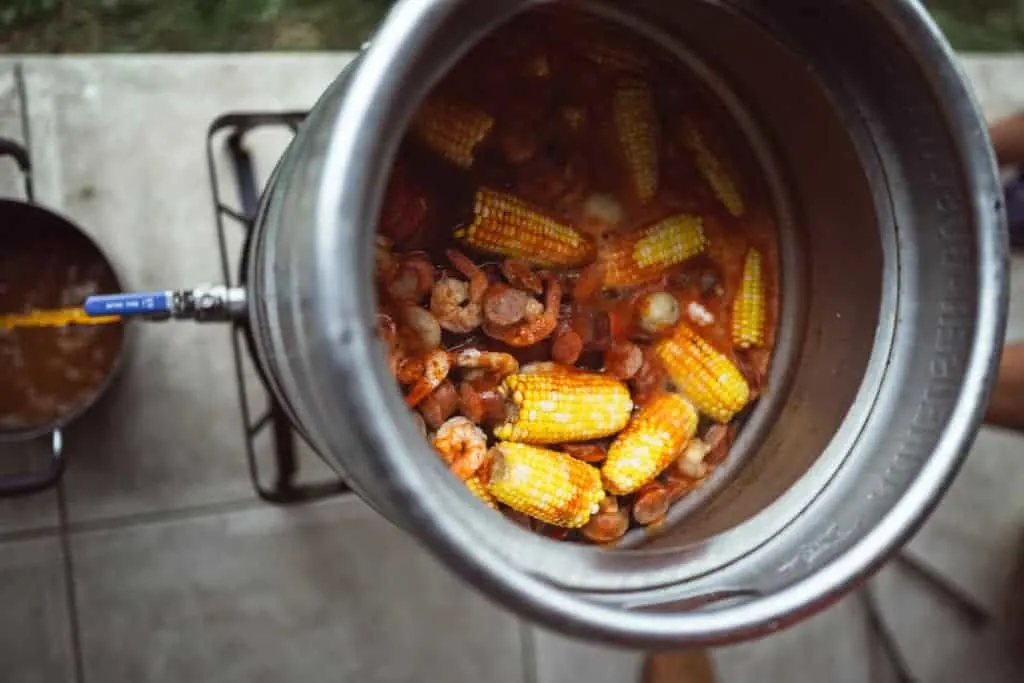 Large Stock Pot draining water for low country shrimp boil