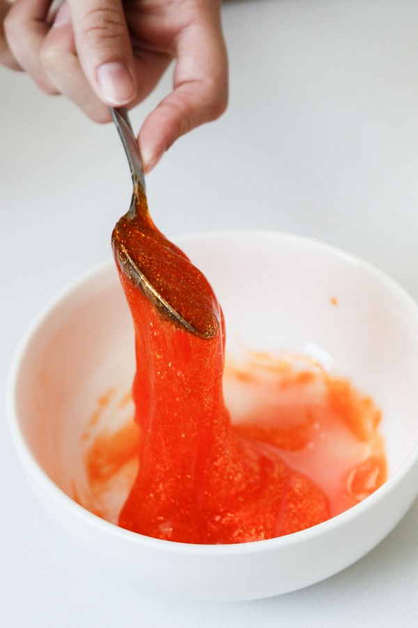 Mixing orange slime in bowl