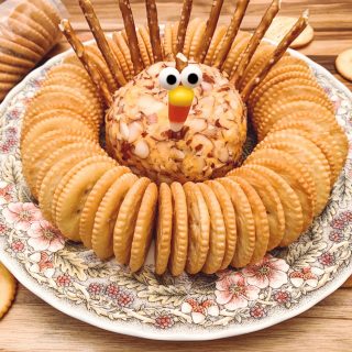 Turkey cheese ball on platter with crackers