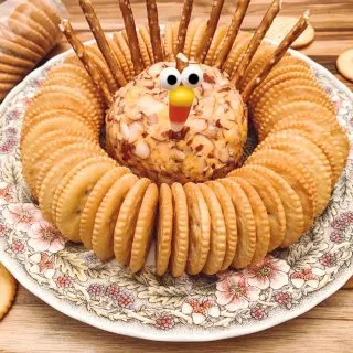 Turkey cheese ball on platter with crackers