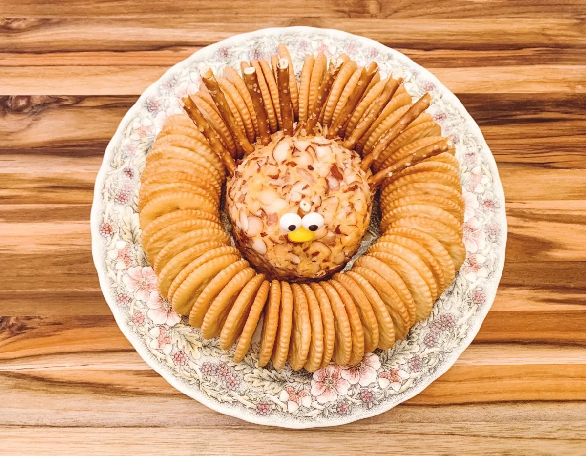 Turkey cheeseball on platter overhead shot