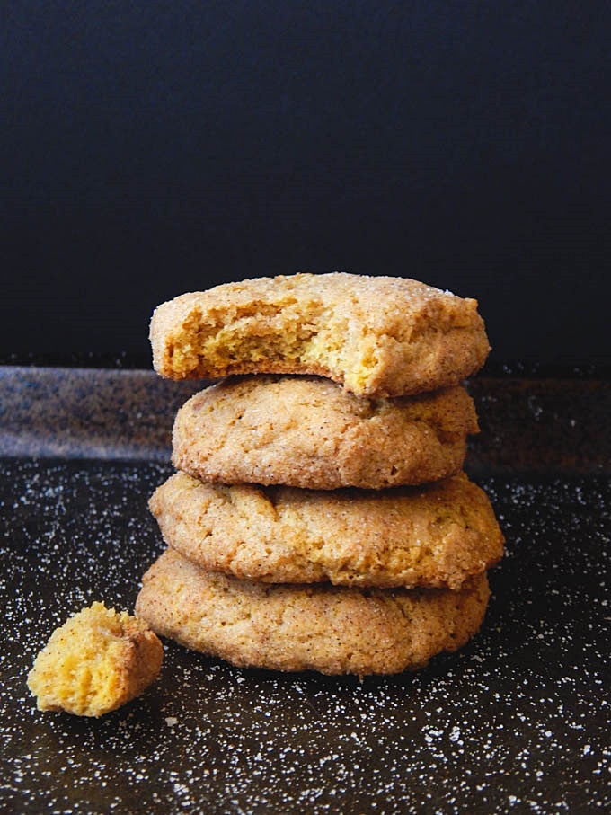 Pumpkin snickerdoodles stacked on top of each other with blank background