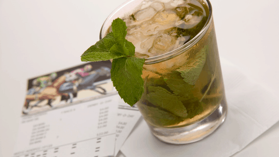 Mint julep and betting tickets for Kentucky Derby