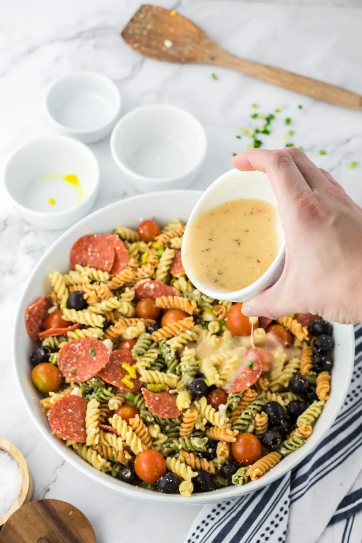 adding italian dressing to pasta salad