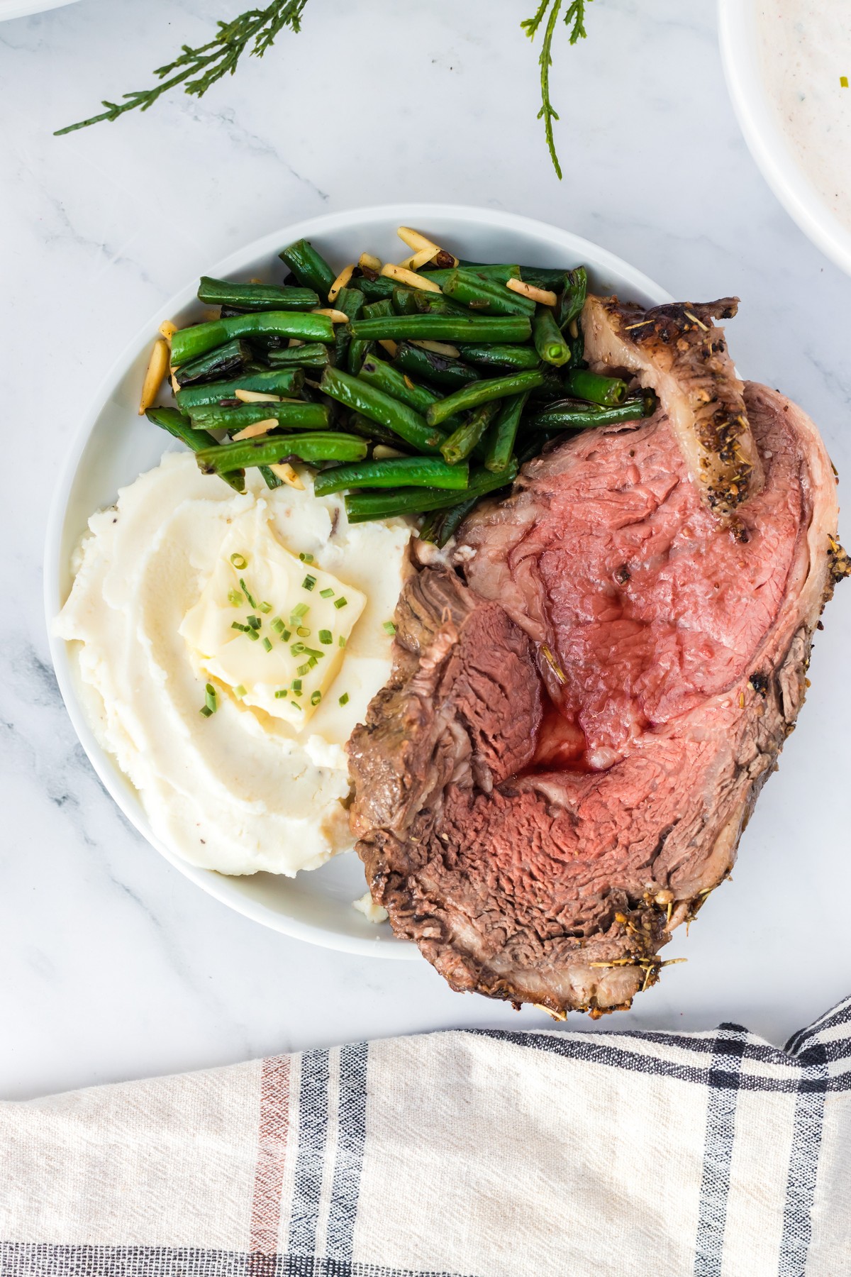 prime rib roast, mashed potatoes, and green beans