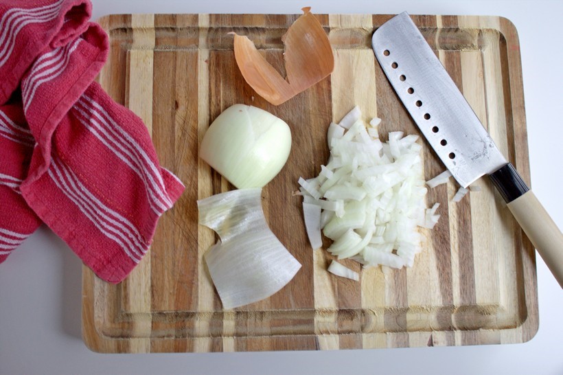 onion chopped on cutting board with knife