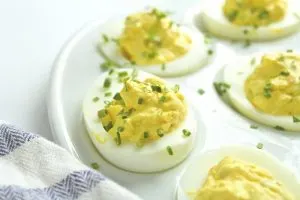 deviled eggs garnished with chives upclose