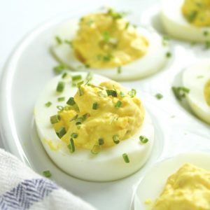 deviled eggs garnished with chives upclose