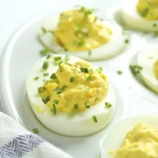 deviled eggs garnished with chives upclose
