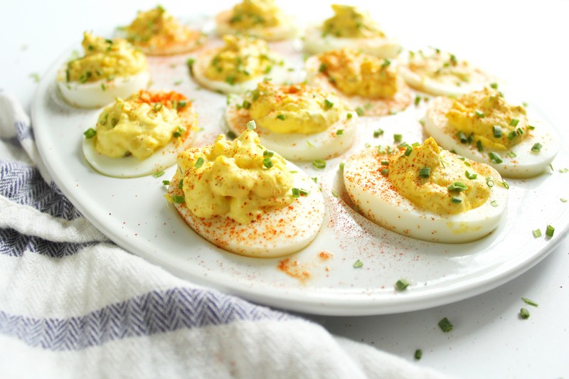 deviled eggs with paprika and chives