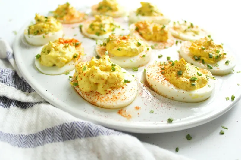 deviled eggs with paprika and chives