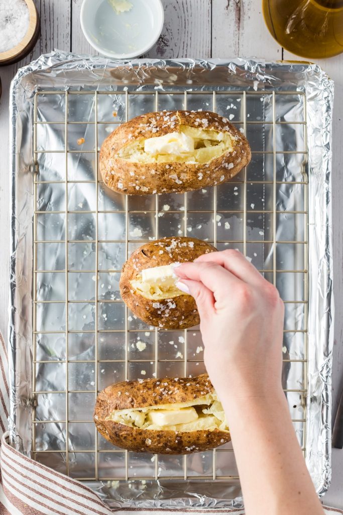 seasoning the inside of a baked potato