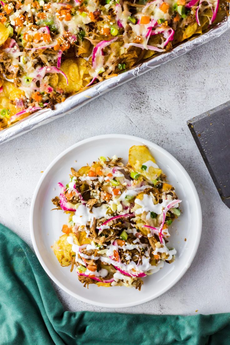 white plate of nachos