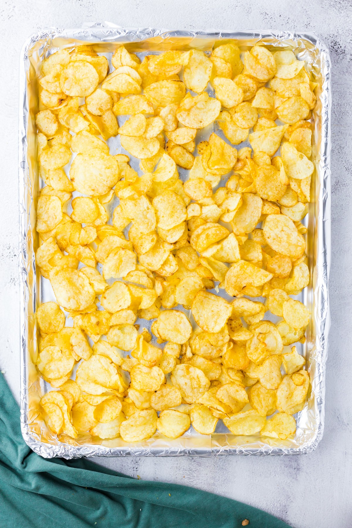 layer of potato chips on baking sheet