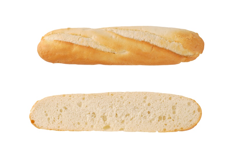 halved french baguette on white background