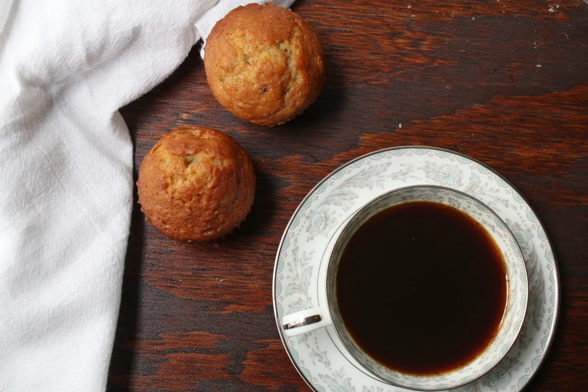 banana bread muffins with cup of coffee
