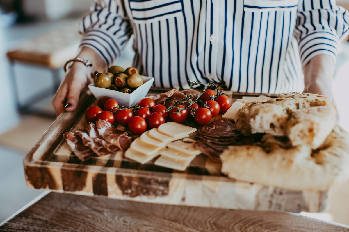 charcuterie board on cutting board held up