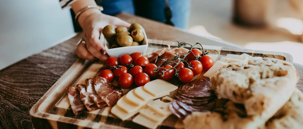 board of olives, meats, and cheeses