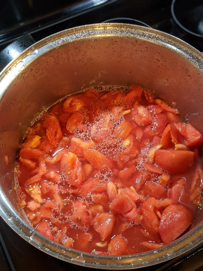 Tomatoes simmering in pot