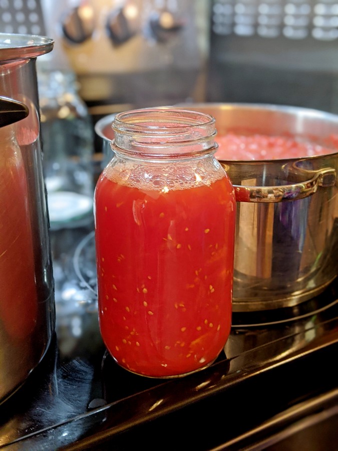 Jar filled with tomatoes