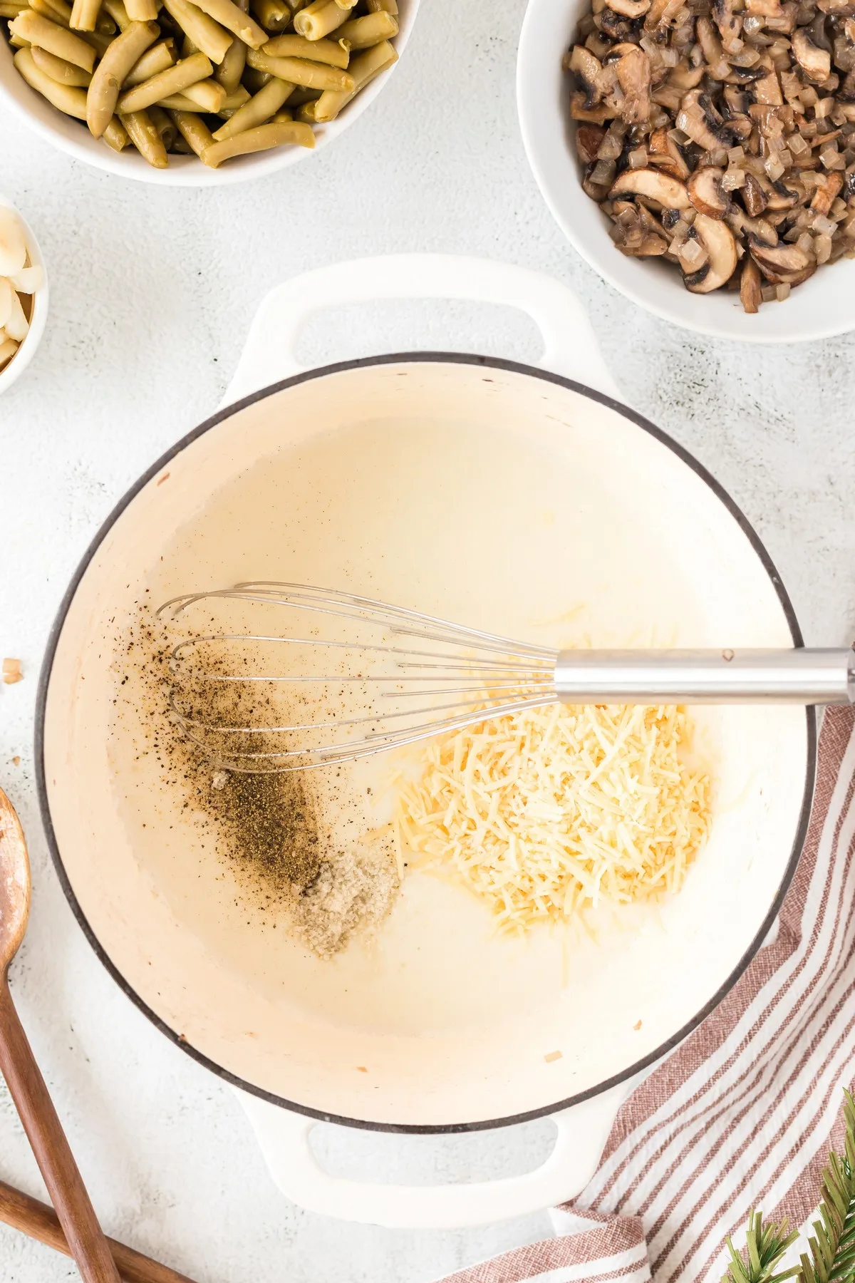 adding cheese and pepper to green bean casserole roux