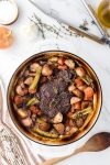 overhead shot of cooked pot roast surrounded by vegetables