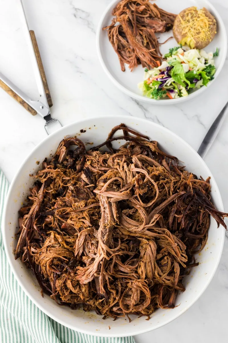 shredded brisket in white bowl