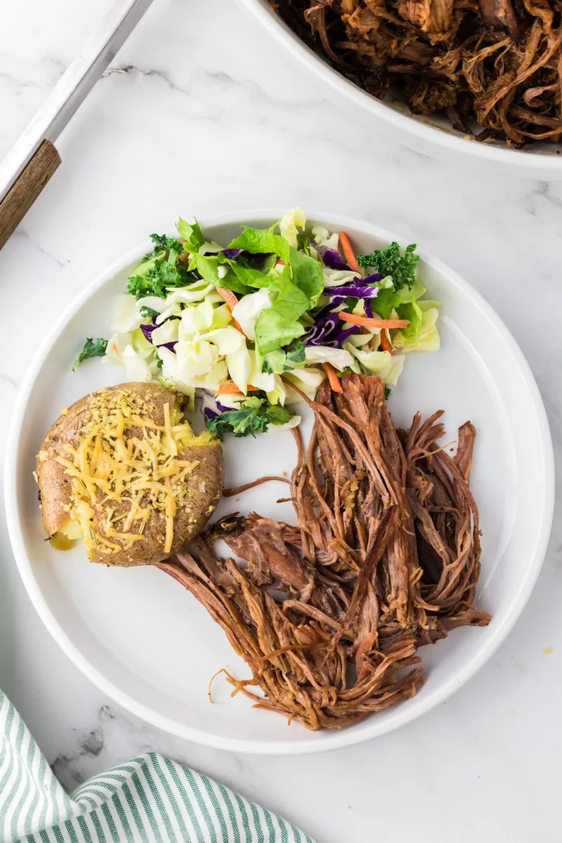 plate of brisket, salad, and potato