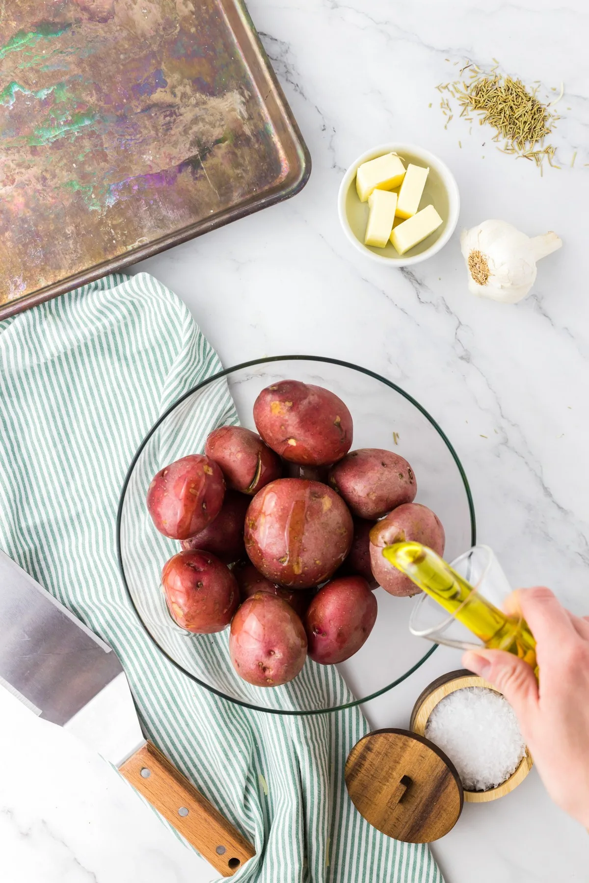 drizzling potatoes with olive oil