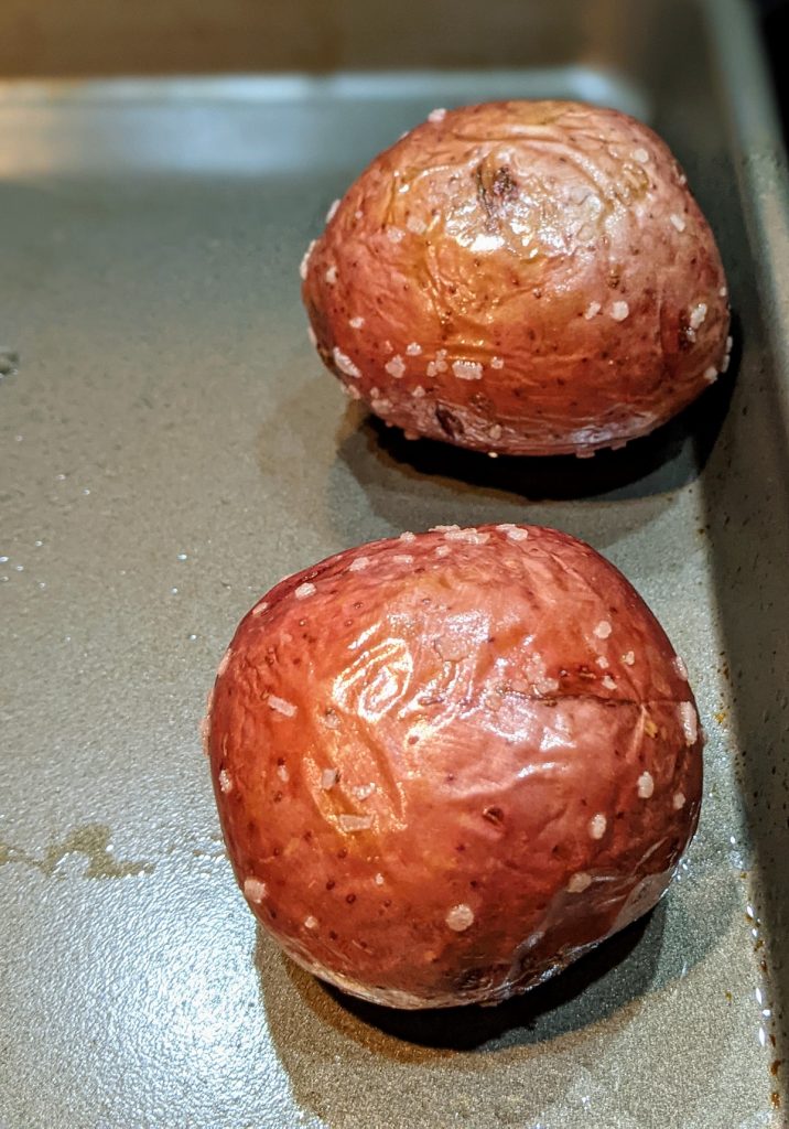 roasted whole red potatoes on baking sheet