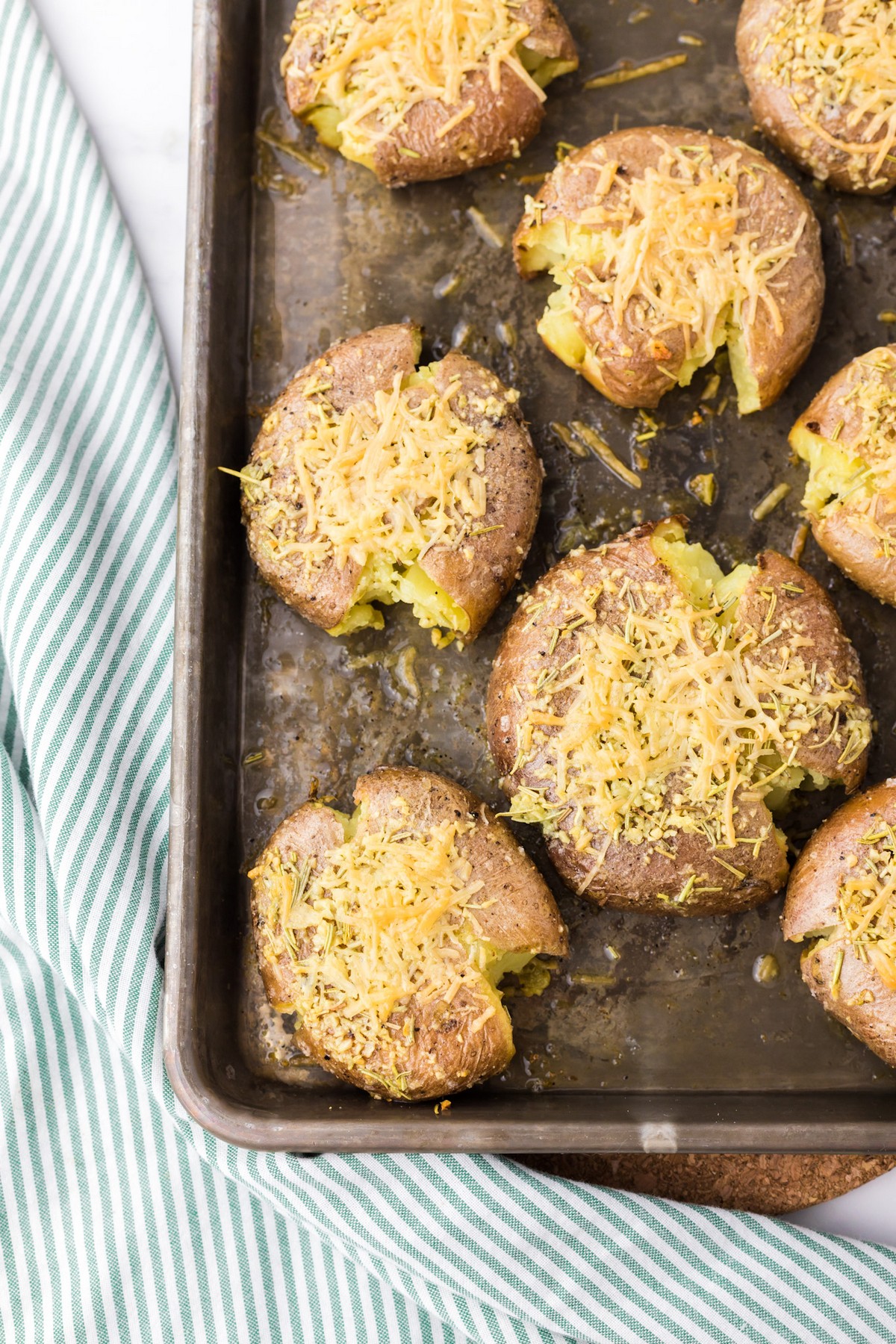 smashed red potatoes with shredded cheese