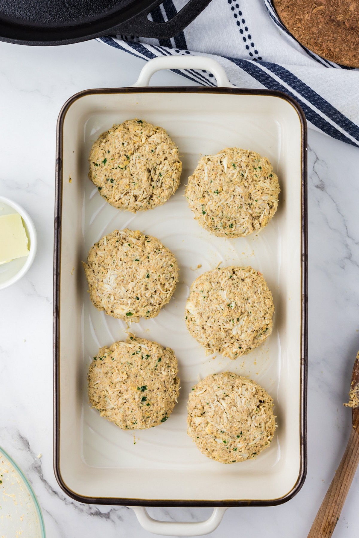 raw crab cakes in dish