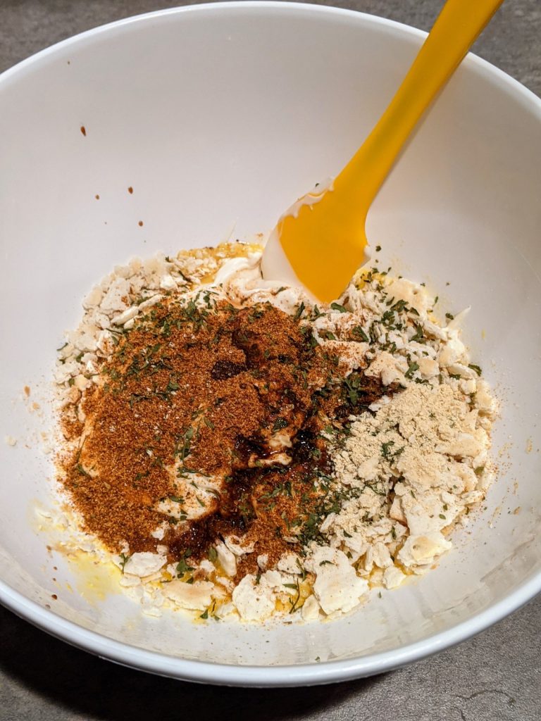 Ingredients for crab cakes in mixing bowl