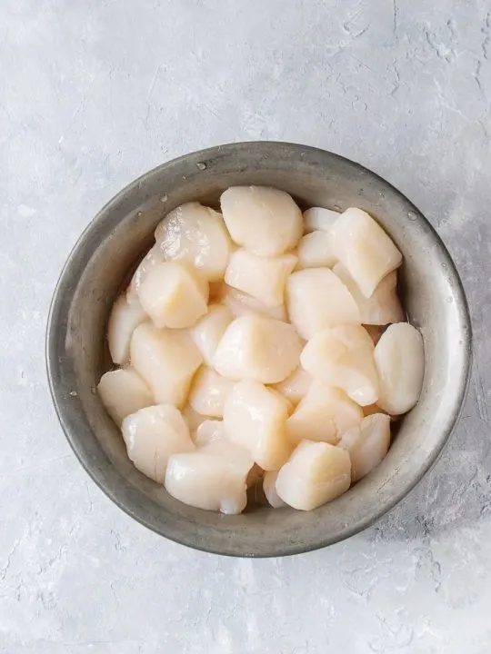 Bowl of raw uncooked scallops