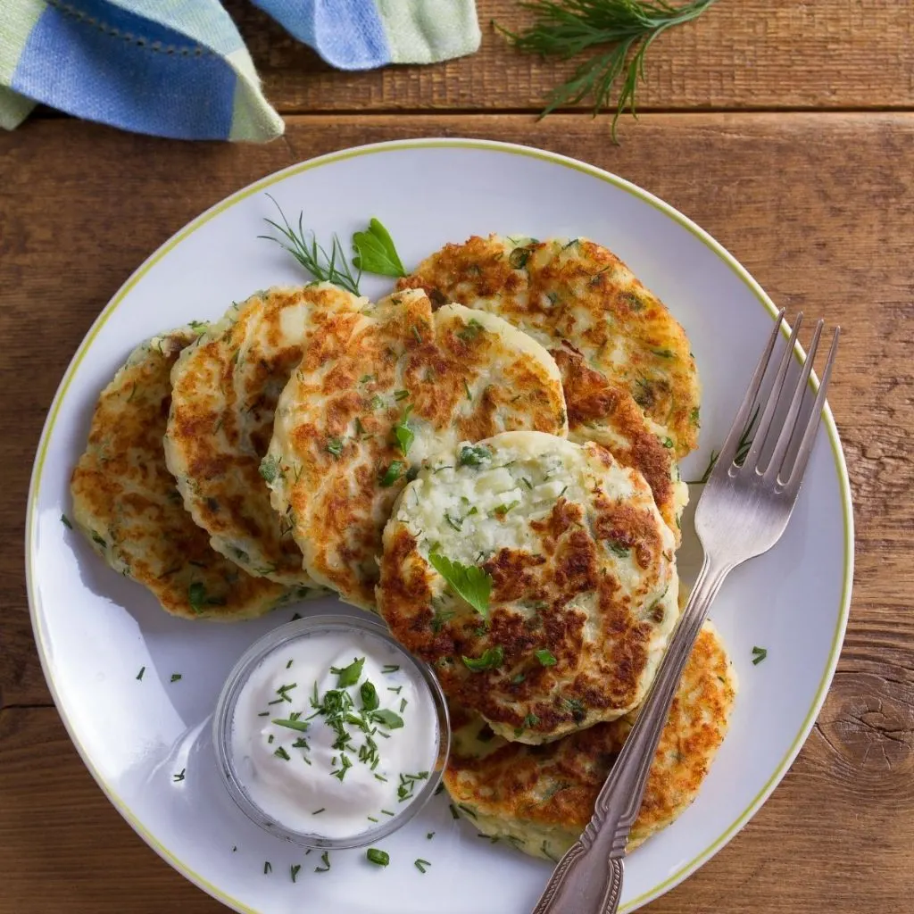 Mashed potato cakes on white plate