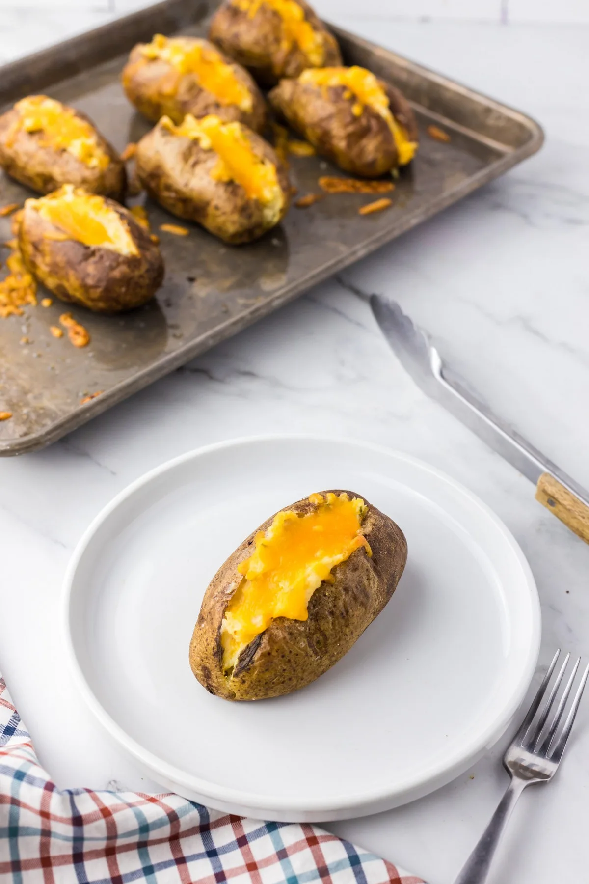 twice baked potato on white plate