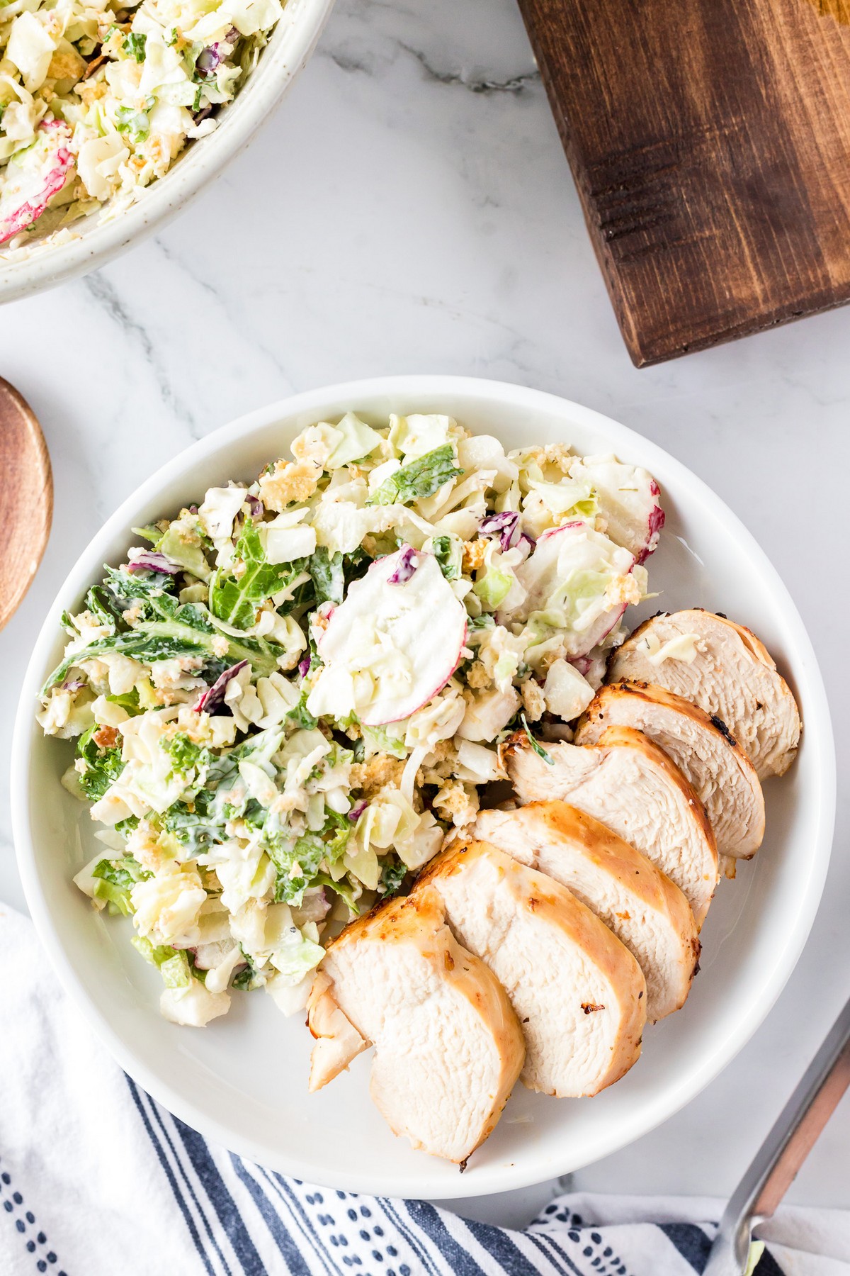 sliced chicken with salad