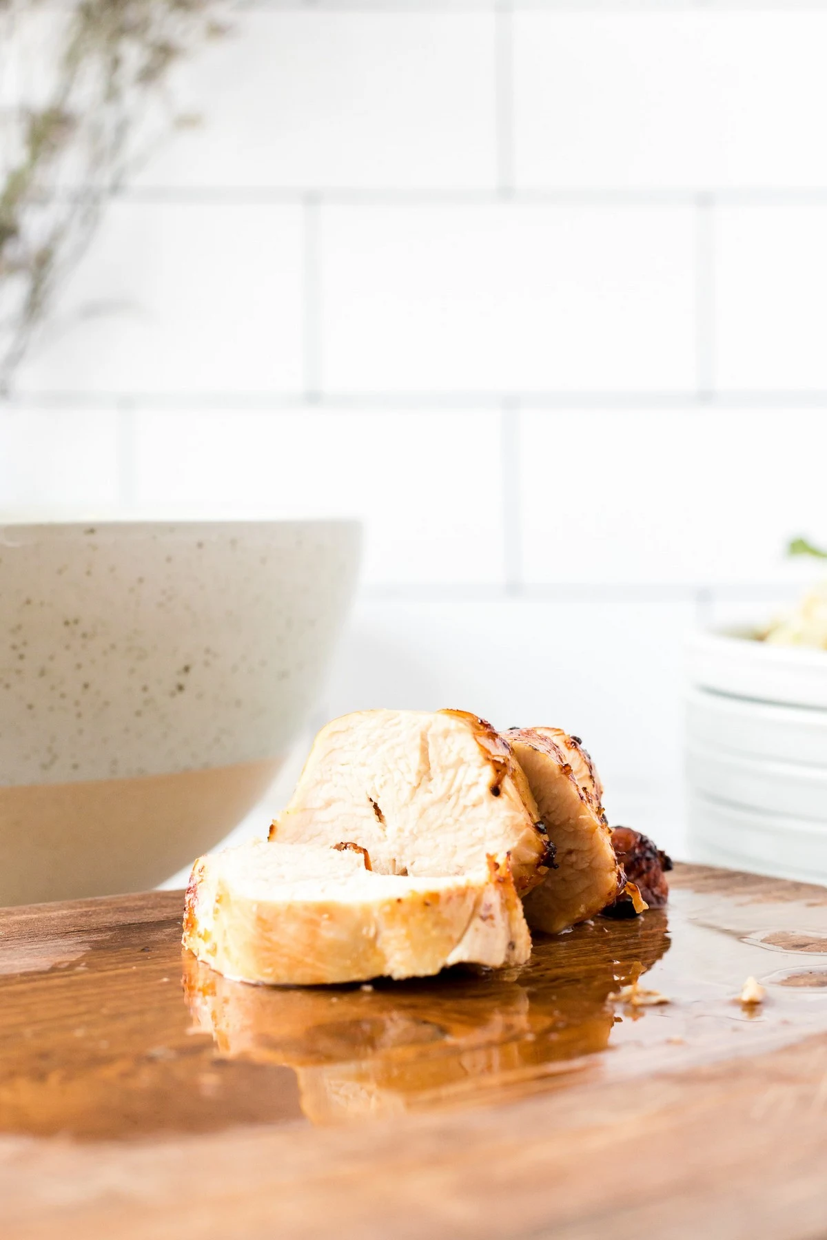 sliced air fryer chicken on cutting board