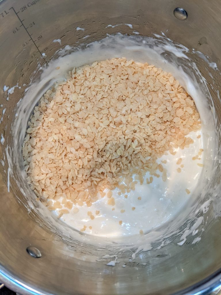 rice krispie cereal on top of marshmallow creme