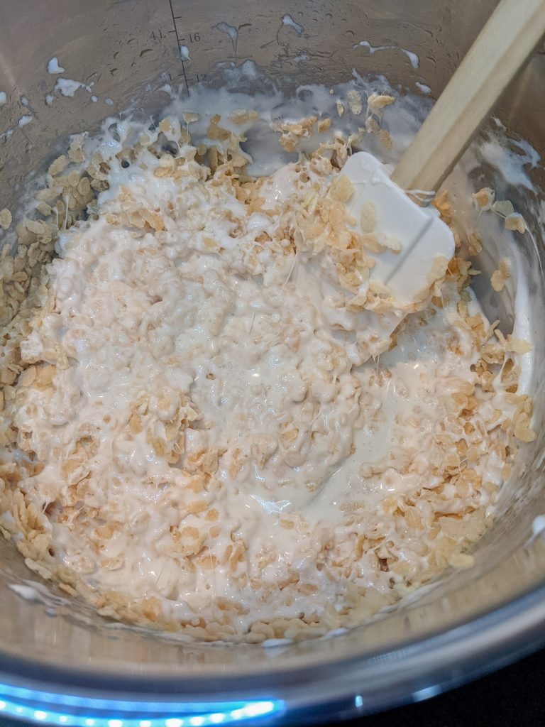mixing rice krispie treats mixture