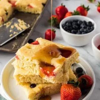 sheet pan pancakes with syrup drizzle