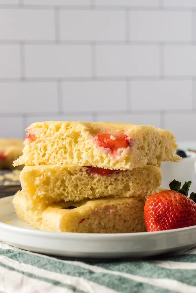 sheet pan pancake slices stacked on top of each other