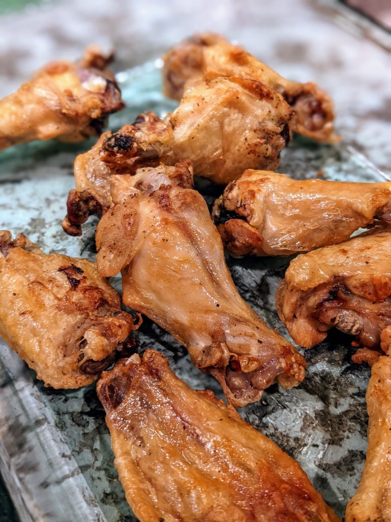 plain chicken drumsticks in clear casserole dish