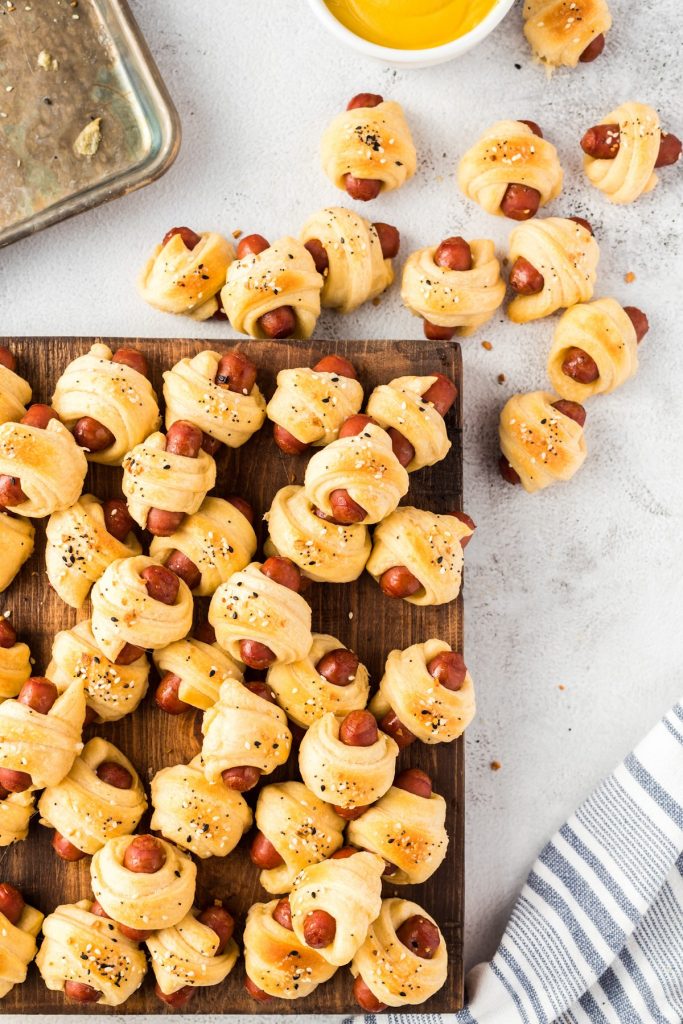 trail of pigs in a blanket from cutting board out of shot