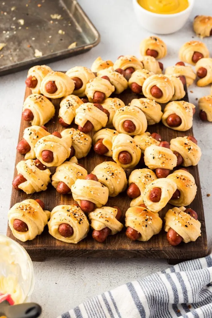 overhead shot of pigs in a blanket on cutting board