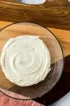 cream cheese frosting in glass bowl