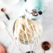 cream cheese frosting on whisk