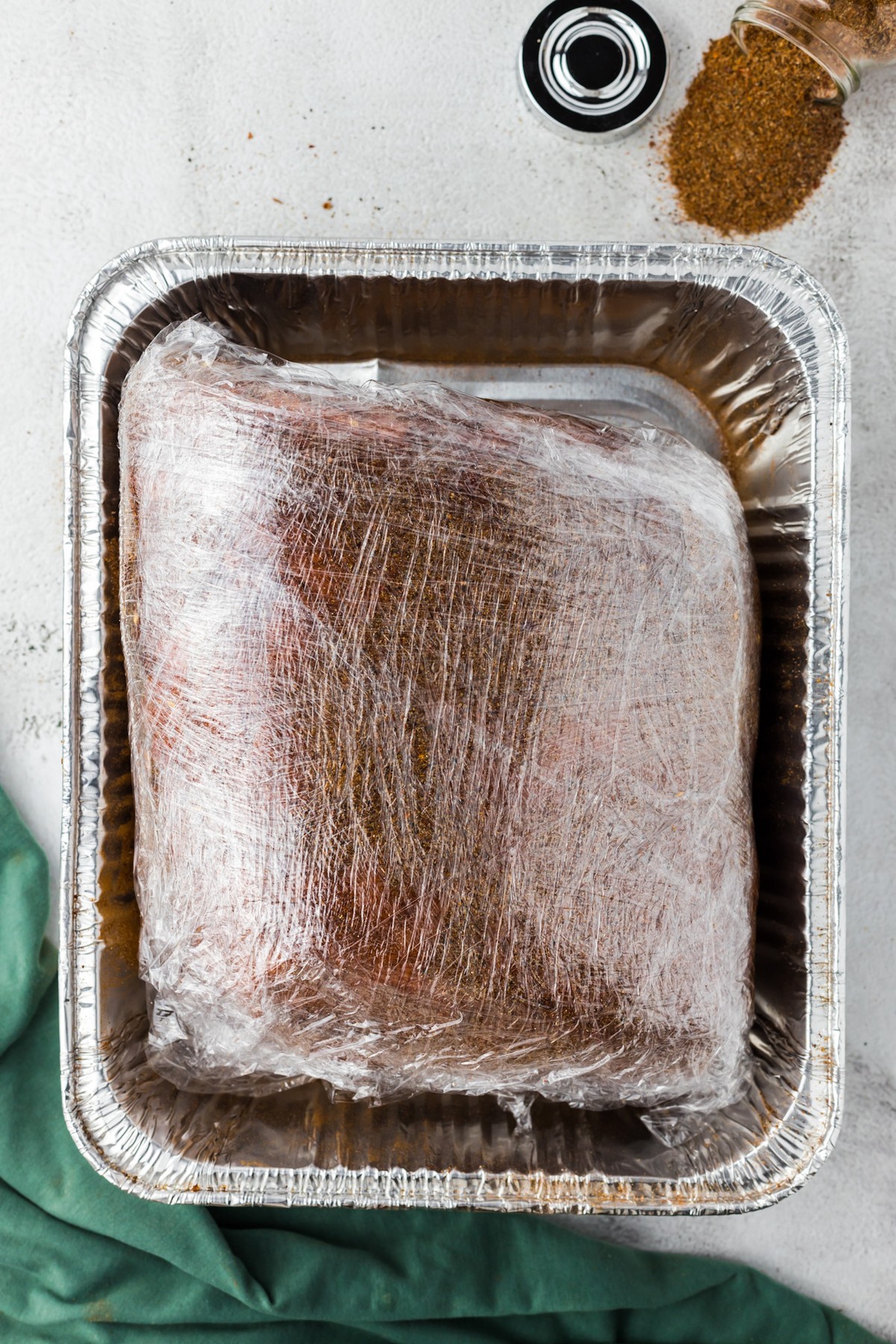 pork shoulder wrapped in plastic wrap