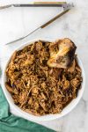 shredded pork shoulder in white dish